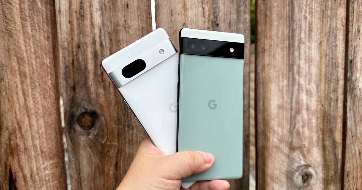 Sage green Pixel 6a and Snow Pixel 7a held in hand.